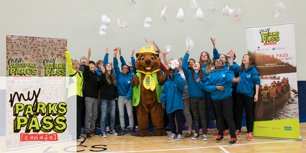 The grand prize winners of the 2017 Canada's Coolest School Trip celebrate with Parka and throw their hats in the air.